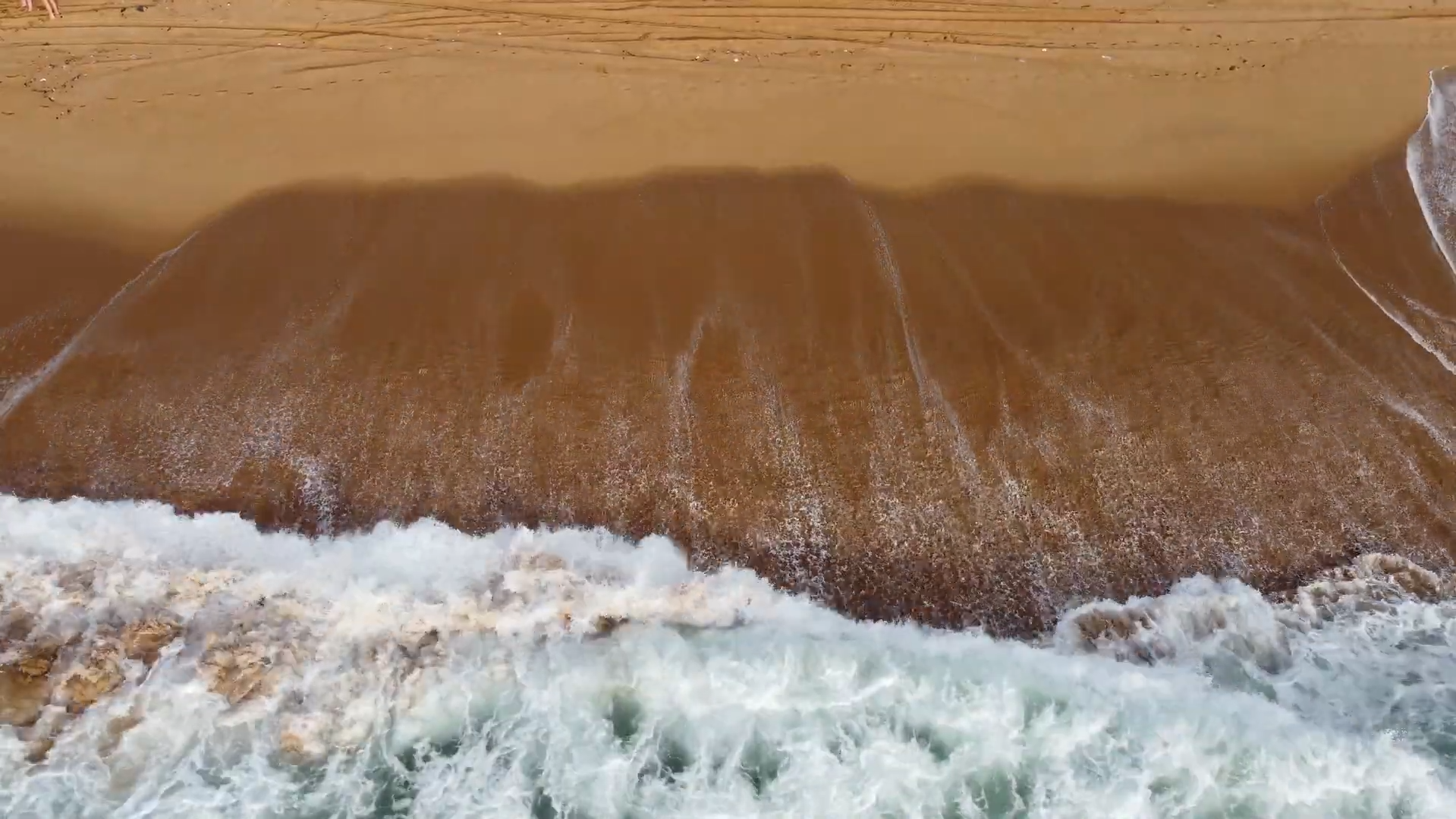 Aerial view of waves breaking